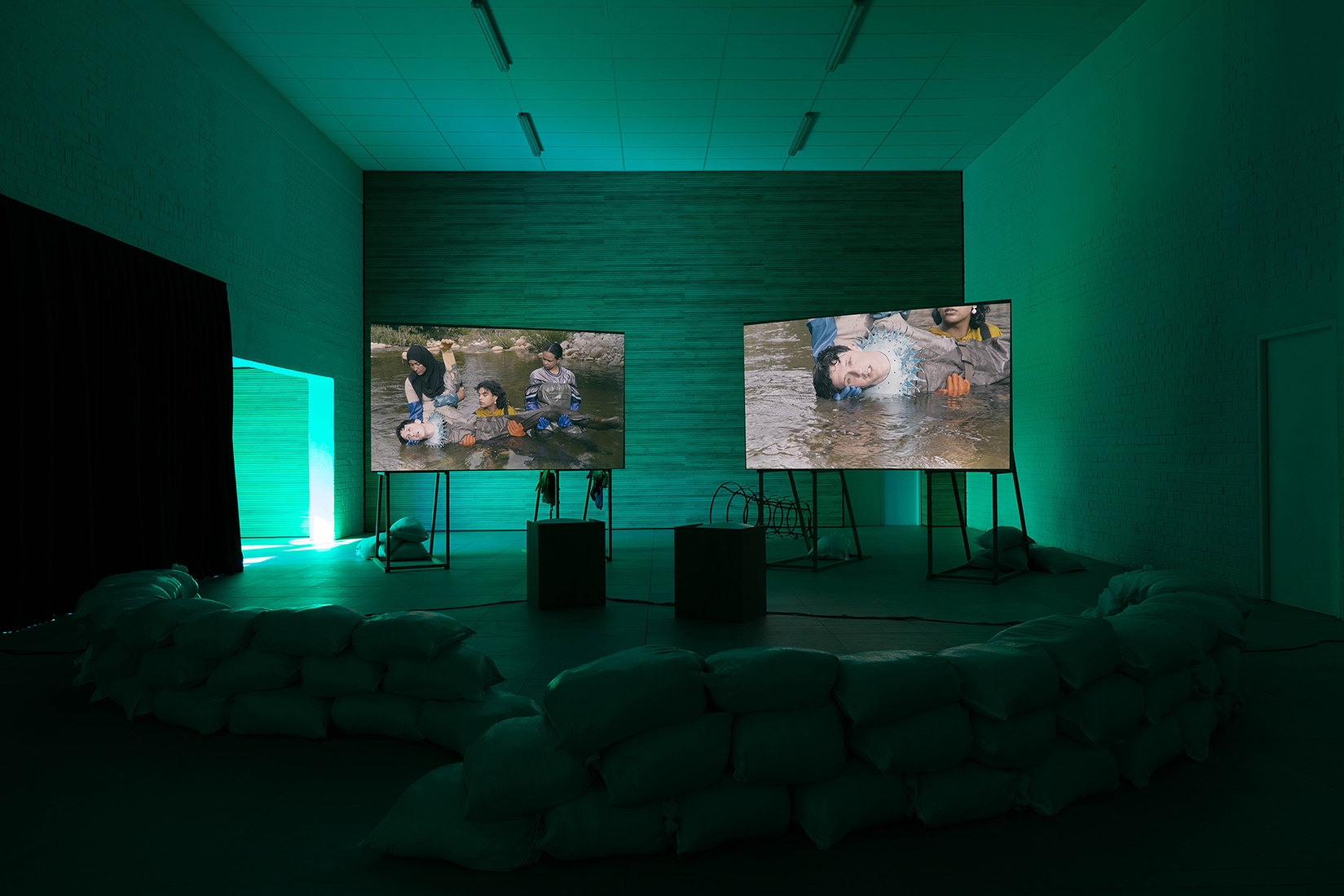 http://mail.abrideswardt.com/files/gimgs/th-81_Installation view Abri de Swardt, Kammakamma (2022-2024), Synchronised two-channel projection, configurable screens, sand from Macassar Dunes, and costumes, 16’54 min 4.jpg
